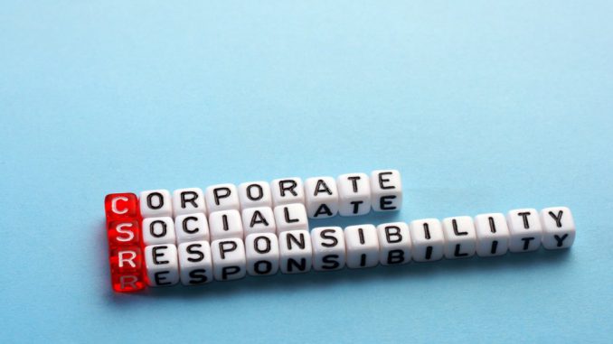 CSR Corporate Social Responsibility acronym on cubes on blue background
