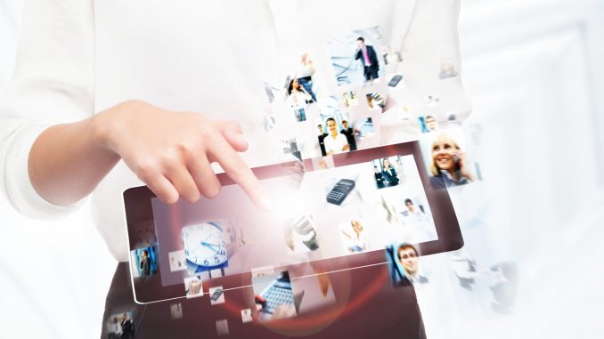 A tablet computer held in female hands