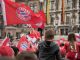 FC Bayern Munich fans in jerseys and with flags in front of Munich City Hall - an example of a strong sports brand