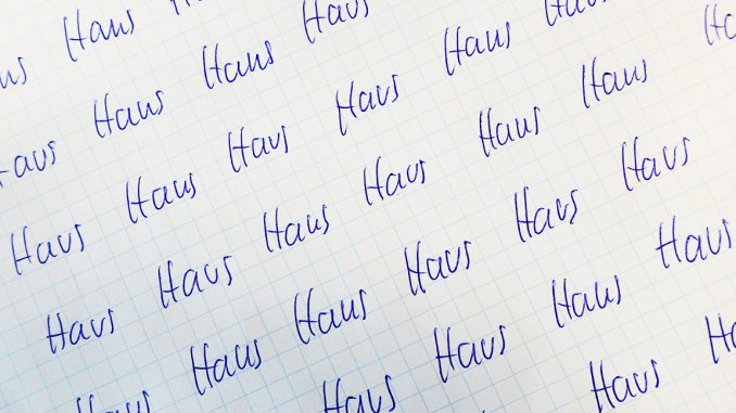 Paper the German word "Haus" written several times on it to provoke a vuja de