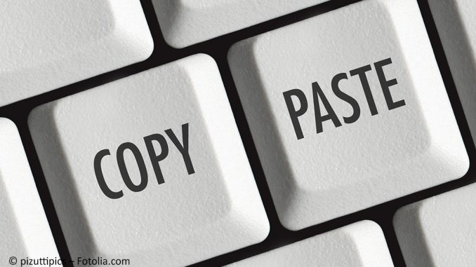 Plagiarism: Close up of a copy and paste key on a keyboard