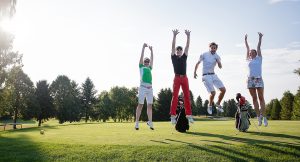 Young people playing golf at a golf club