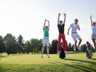 Young people playing golf at a golf club