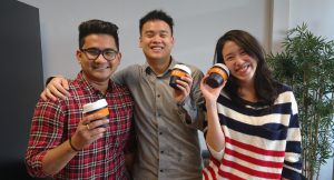 MBS students proudly presenting their new reusable coffee cup