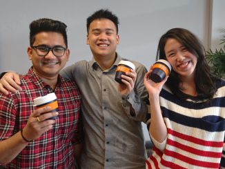 MBS students proudly presenting their new reusable coffee cup