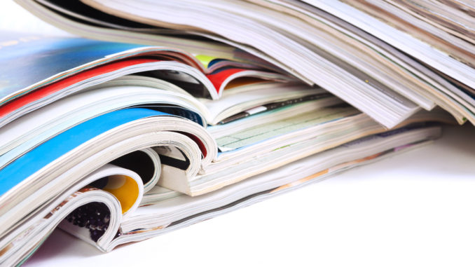 a stack of various journals and magazines