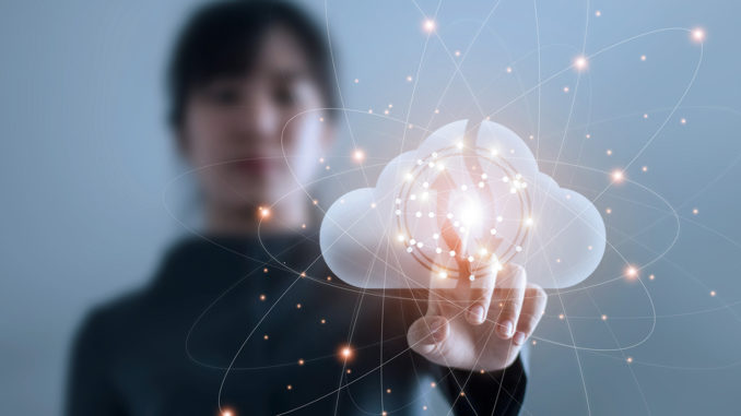 Cloud Computing Businesswoman maintaining contact with data via cloud computing networks.