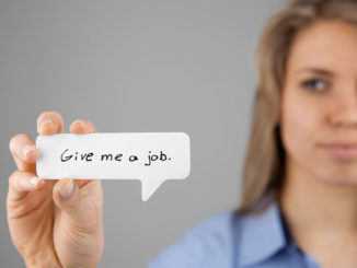Young woman holding comics bubble with text "Give me a job"