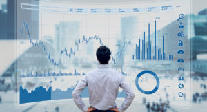 Finance Manager analyzes stock market indicators for best investment strategy, financial data and charts with business buildings in background