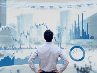 Finance Manager analyzes stock market indicators for best investment strategy, financial data and charts with business buildings in background