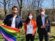 Christoph Schlottmann, Dr. Christine Menges and Prof. Dr. Stefan Baldi with the signed Diversity Charter and Pride flags in the garden of Munich Business School.