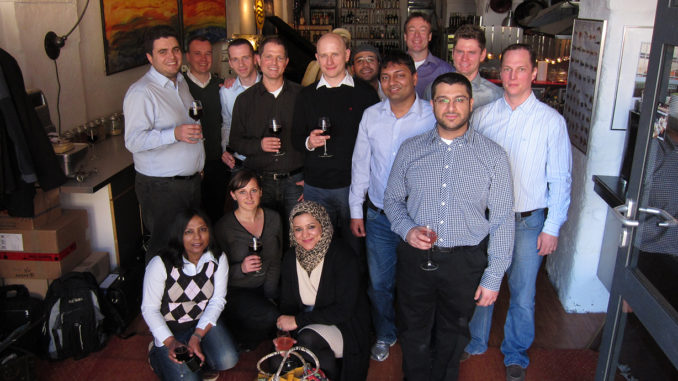 Group photo of Sachin Bansal's MBA cohort at Munich Business School during a cooking class team building event