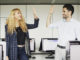 Two students high-fiving in the computer lab of Munich Business School.