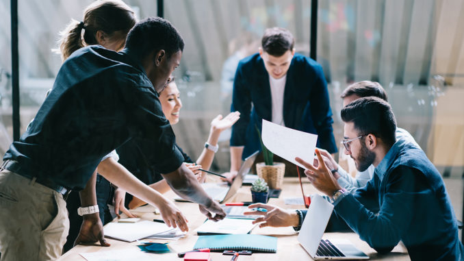 A diverse group of professionals working together on a project