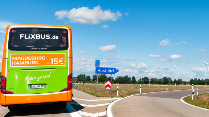 A FlixBus bus on the road, seen from behind