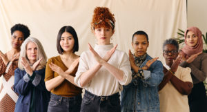 A group of women gesturing the 