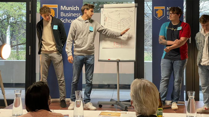 The winning team presents its ideas to the jury of the consultancy game simulation at Munich Business School