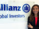 Bachelor's student Julia Church standing next to the Allianz Global Investors logo during her internship