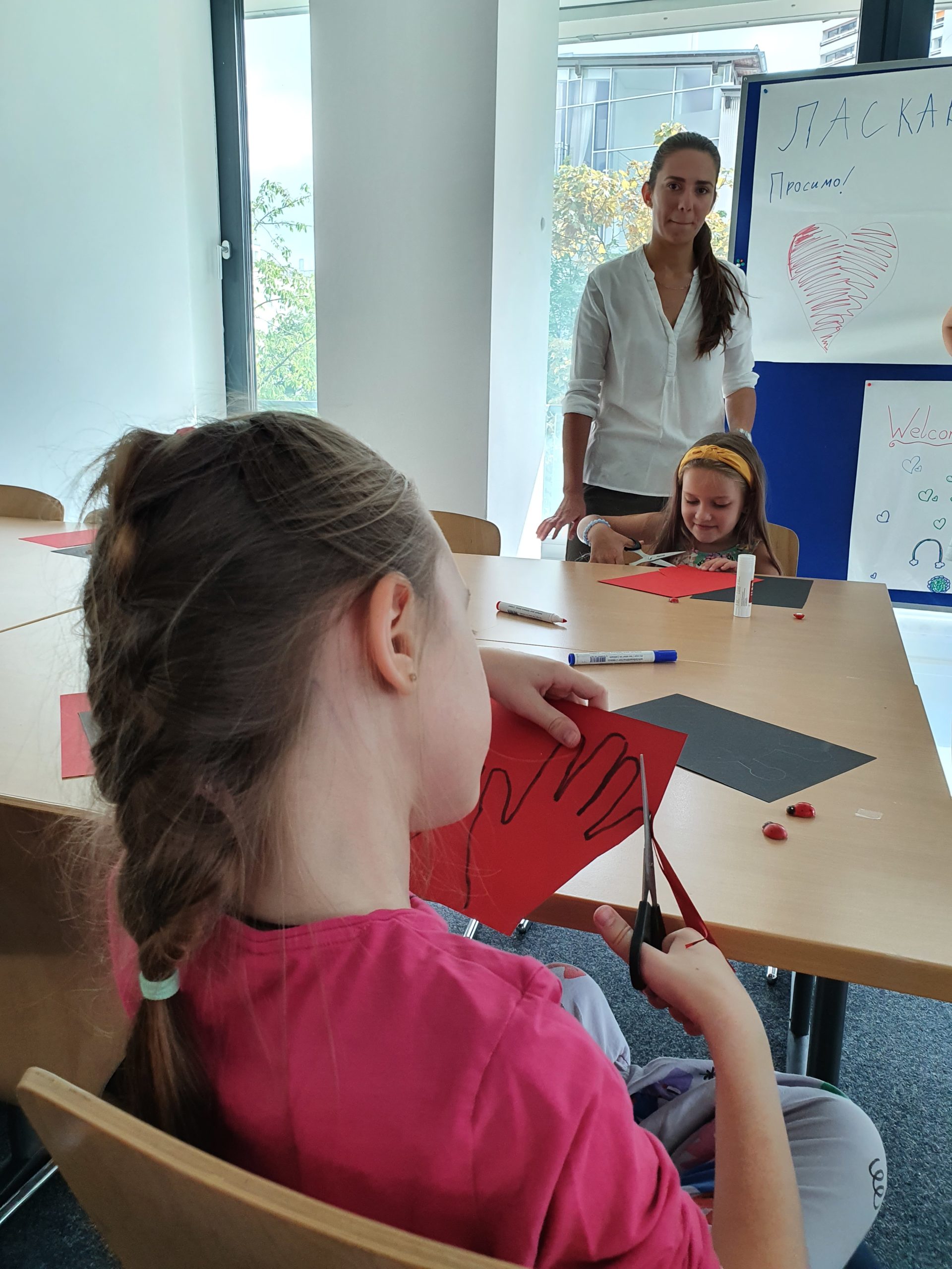 Two girls doing crafts with clay cardboard
